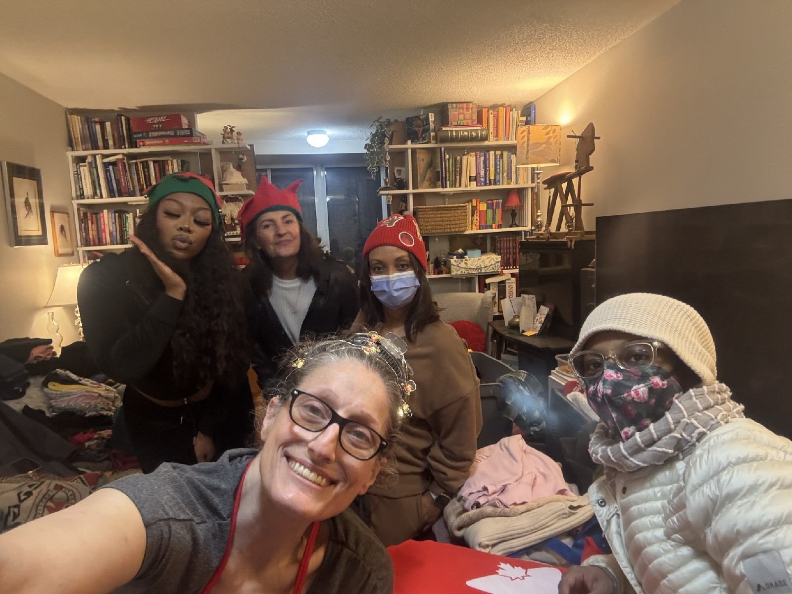 Adriana Violo and the Adry's Angels volunteer team sorting clothing donations for the annual Christmas Care Pack Drive